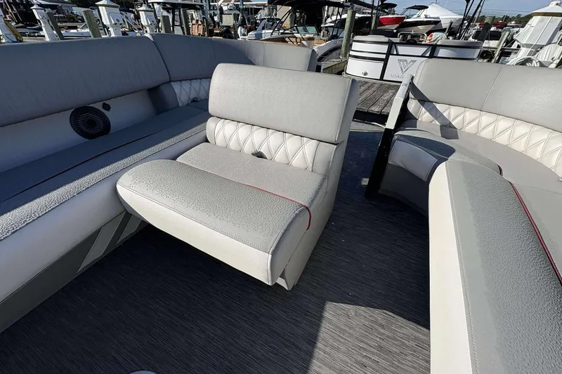 Slide: The Image of Luxurious seating on a 2021 Bennington 27RX boat, featuring elegant upholstery and spacious design. - 13
