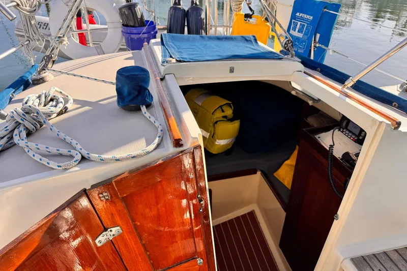Slide: The Image of 1979 O'Day 37 Center Cockpit sailboat interior with ropes and safety equipment. - 12