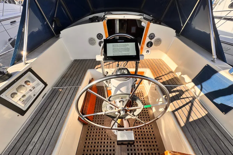 Slide: The Image of 1979 O'Day 37 Center Cockpit with steering wheel and navigation equipment. - 17