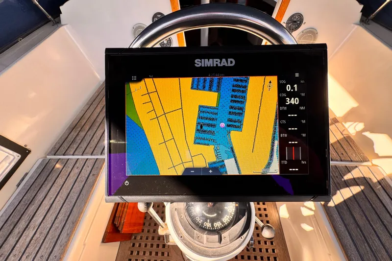 Slide: The Image of Simrad navigation display on 1979 O'Day 37 Center Cockpit sailboat, showing nautical chart. - 18
