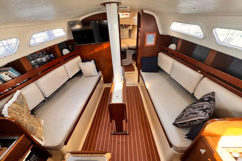 Slide: The Image of 1979 O'Day 37 Center Cockpit interior with cozy seating and elegant wood finish. - 2