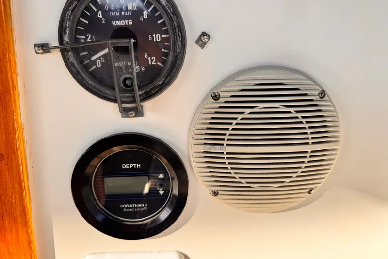 Slide: The Image of 1979 O'Day 37 Center Cockpit instruments: speedometer, depth gauge, and speaker. - 24