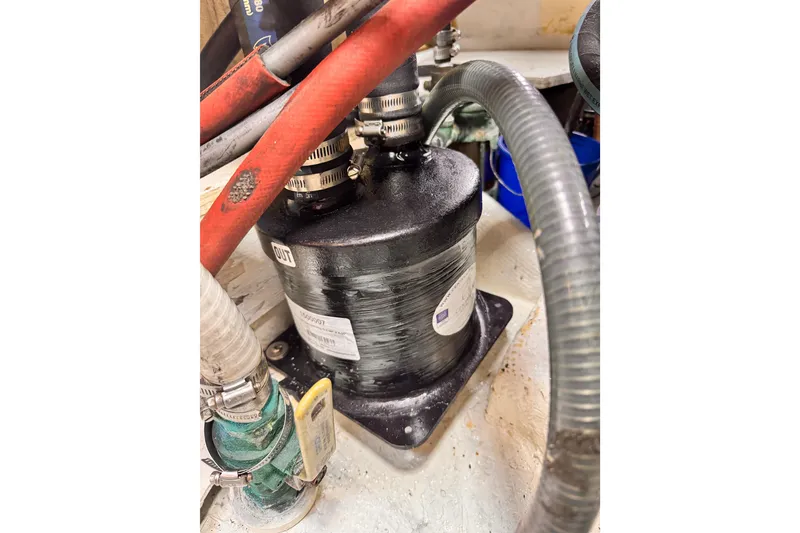 Slide: The Image of Engine compartment of 1979 O'Day 37 Center Cockpit with hoses and filter system. - 29