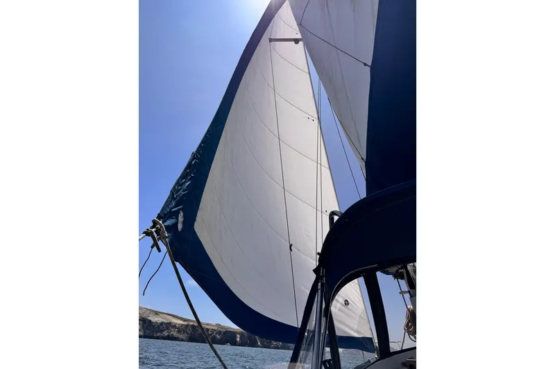 Slide: The Image of Sailing on a 1979 O'Day 37 Center Cockpit with full sails under clear blue skies. - 31