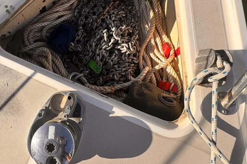 Slide: The Image of Anchor locker of 1979 O'Day 37 Center Cockpit with ropes and chains. - 32