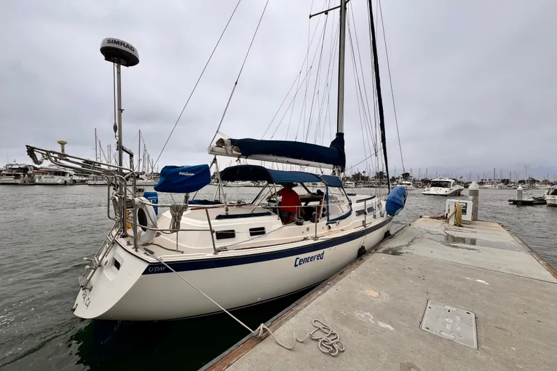 Slide: The Image of 1979 O'Day 37 Center Cockpit sailboat docked at a marina on a cloudy day. - 33