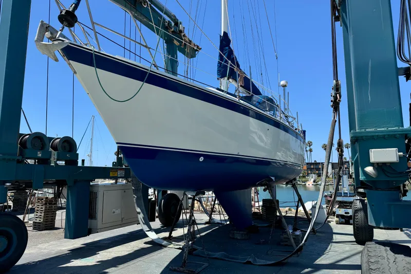 Slide: The Image of 1979 O'Day 37 Center Cockpit sailboat in dry dock, undergoing maintenance. - 35