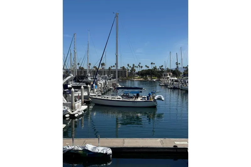 Slide: The Image of 1979 O'Day 37 Center Cockpit sailboat docked in a sunny marina. - 36