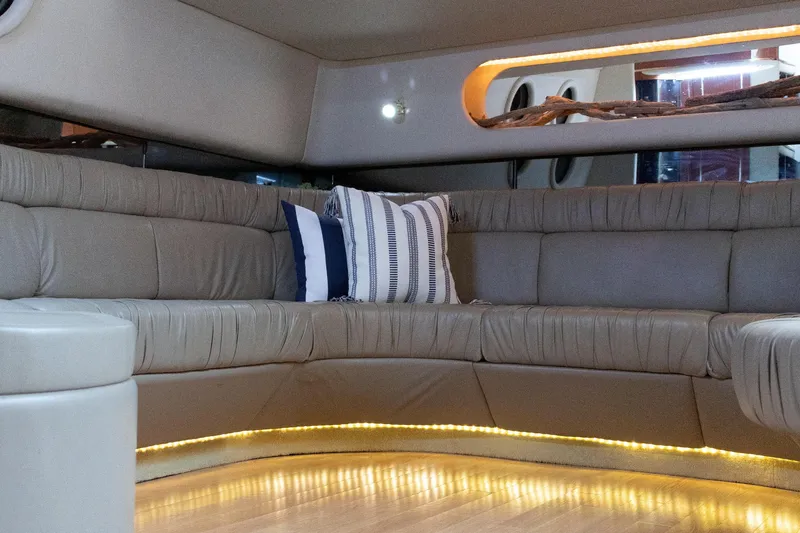 Slide: The Image of Luxurious interior of 1995 Sea Ray 500 Sundancer with plush seating and ambient lighting. - 10