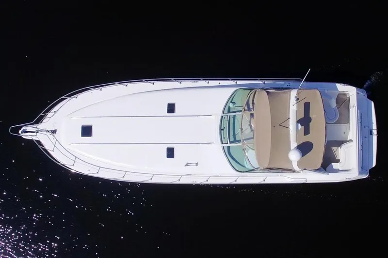 Slide: The Image of Overhead view of 1995 Sea Ray 500 Sundancer yacht on dark water. - 3