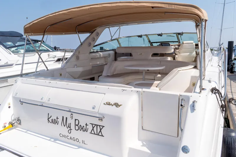 Slide: The Image of 1995 Sea Ray 500 Sundancer yacht docked, featuring spacious seating and canopy, Chicago, IL. - 5