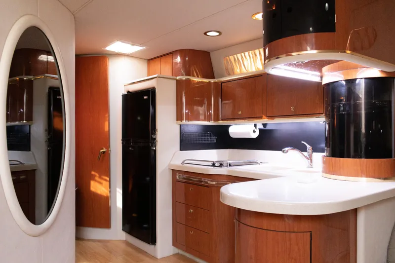 Slide: The Image of Luxurious 1995 Sea Ray 500 Sundancer yacht interior with modern kitchen amenities. - 8