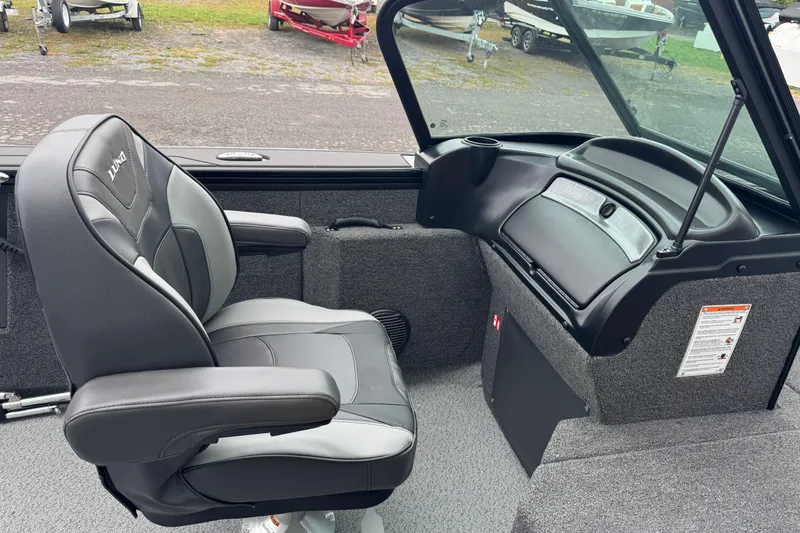 Slide: The Image of 2026 Lund 2075 Fisherman boat interior with comfortable seating and dashboard view. - 5