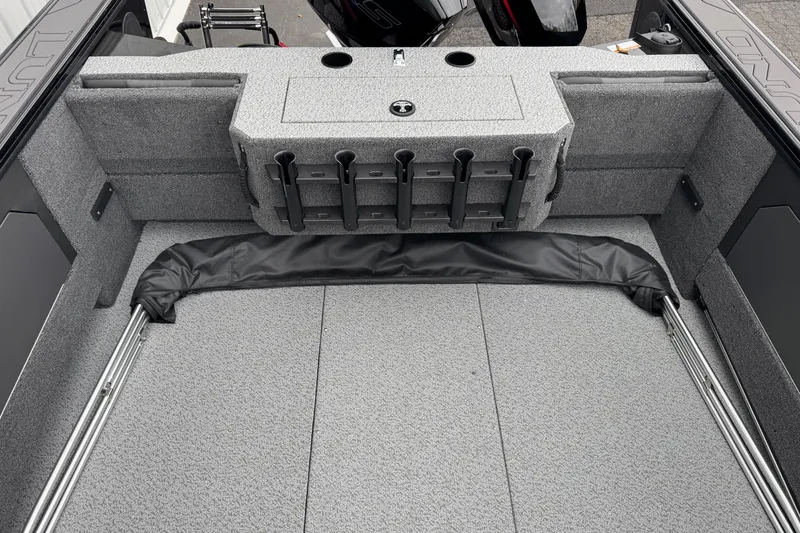 Slide: The Image of 2026 Lund 2075 Fisherman boat interior with rod holders and storage compartments. - 9
