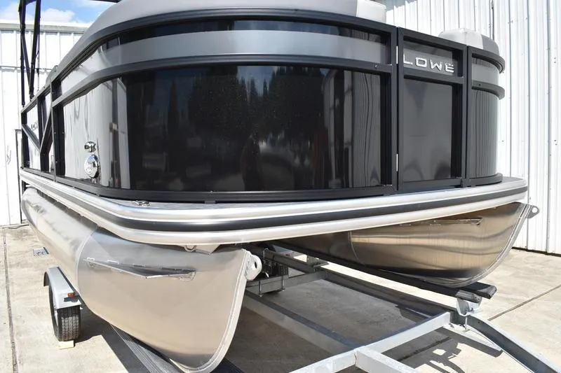 Slide: The Image of 2026 Lowe LS 170 boat seating with gray upholstery and modern design. - 12