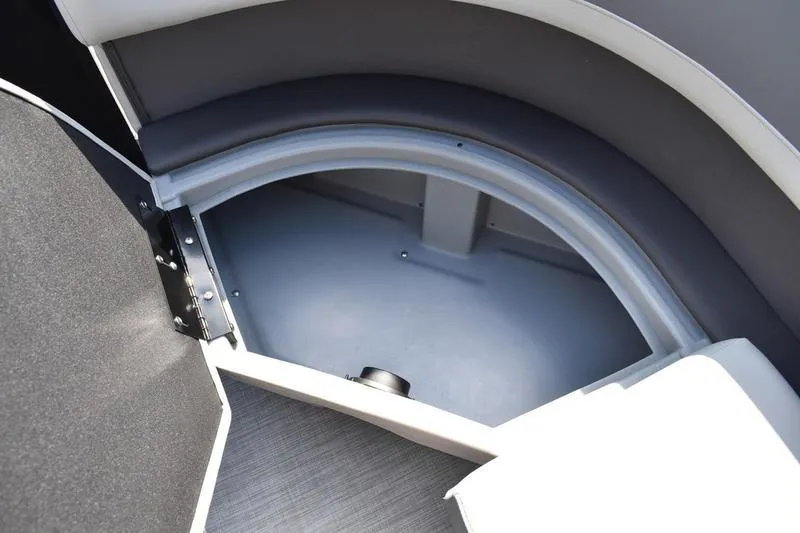 Slide: The Image of Interior of 2026 Lowe LS 170 boat, featuring storage compartment and cup holders. - 15