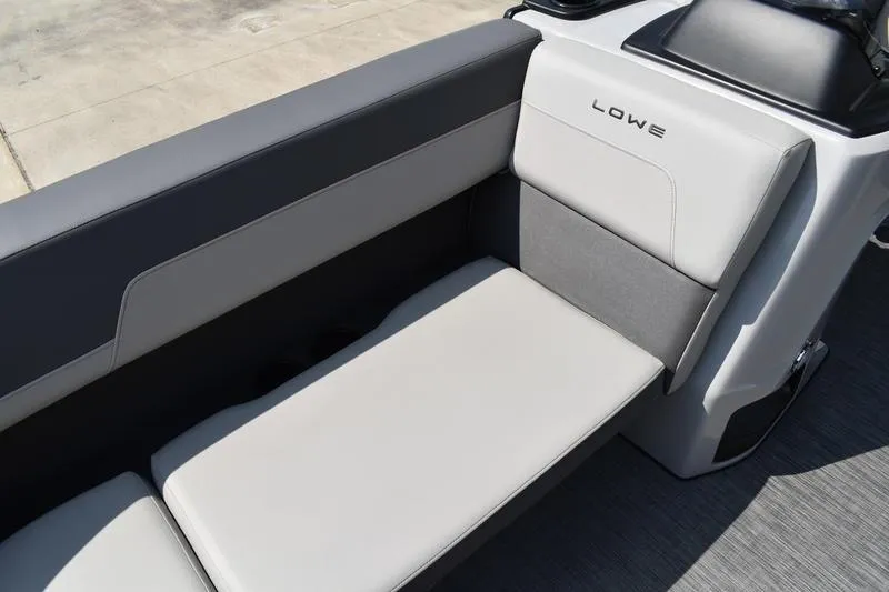 Slide: The Image of Gray seating area of 2026 Lowe LS 170 boat, featuring modern design and comfortable cushions. - 17