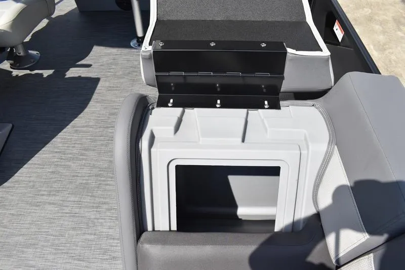 Slide: The Image of Open storage compartment in a 2026 Lowe LS 170 boat, featuring gray upholstery. - 19