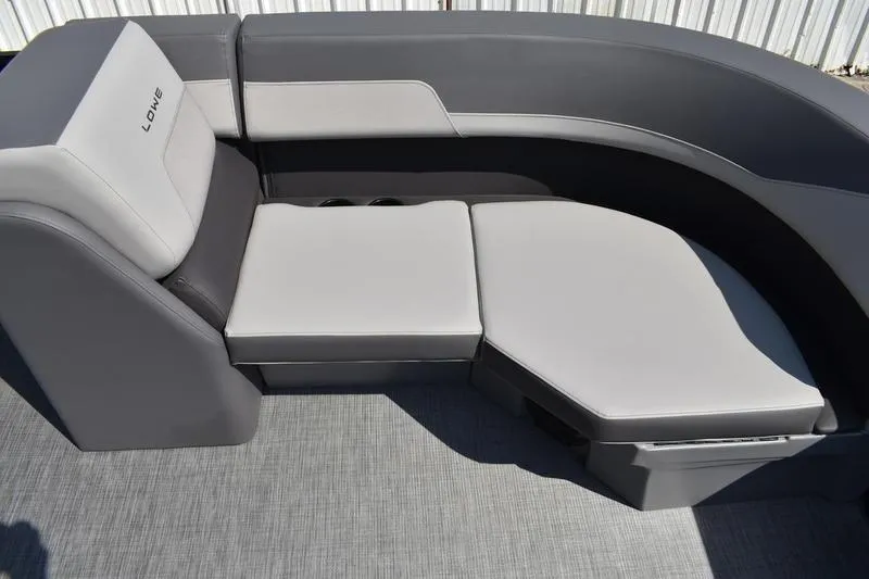 Slide: The Image of Interior of 2026 Lowe LS 170 boat with storage compartment and cup holders. - 20