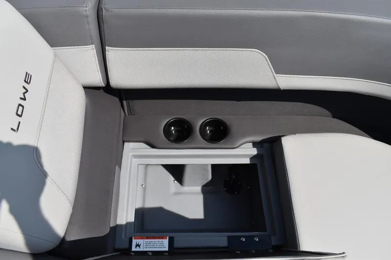 Slide: The Image of Interior seating of 2026 Lowe LS 170 boat, featuring gray upholstery and storage space. - 21