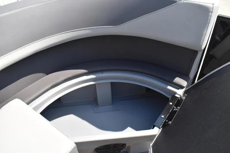Slide: The Image of 2026 Lowe LS 170 boat interior with gray seating and built-in cup holders. - 22
