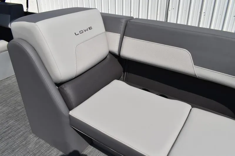 Slide: The Image of 2026 Lowe LS 170 boat interior with steering console and captain's chair. - 24