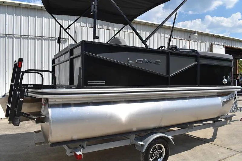 Slide: The Image of 2026 Lowe LS 170 boat exterior with sleek black finish and logo. - 3