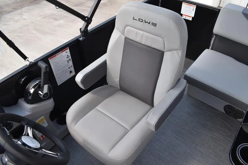Slide: The Image of 2026 Lowe LS 170 boat dashboard with steering wheel and gauges. - 30