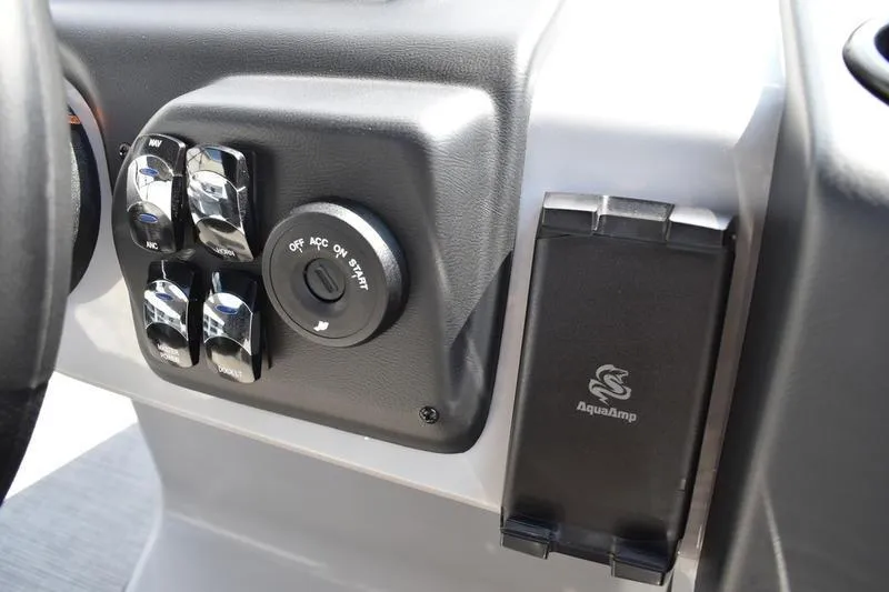 Slide: The Image of 2026 Lowe LS 170 boat seat storage with cup holders, gray and white upholstery. - 37