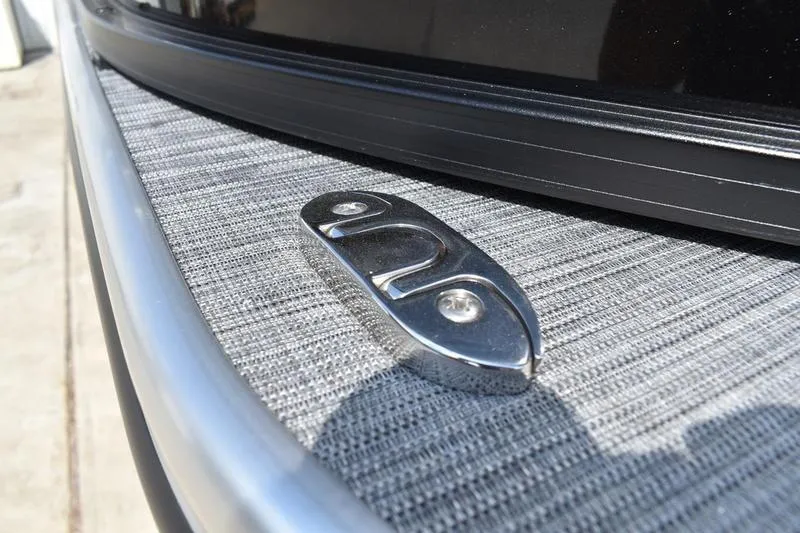 Slide: The Image of Close-up of a 2026 Lowe LS 170 boat cleat on textured surface. - 43
