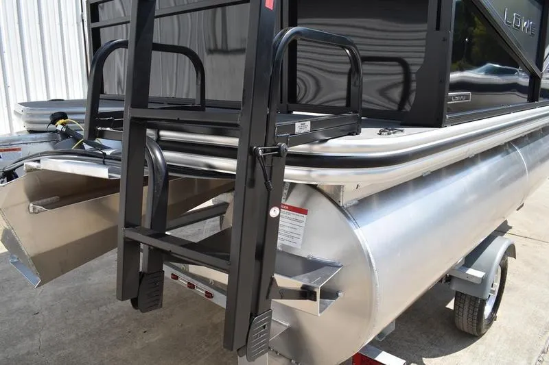 Slide: The Image of 2026 Lowe LS 170 pontoon boat rear view with ladder and trailer. - 5