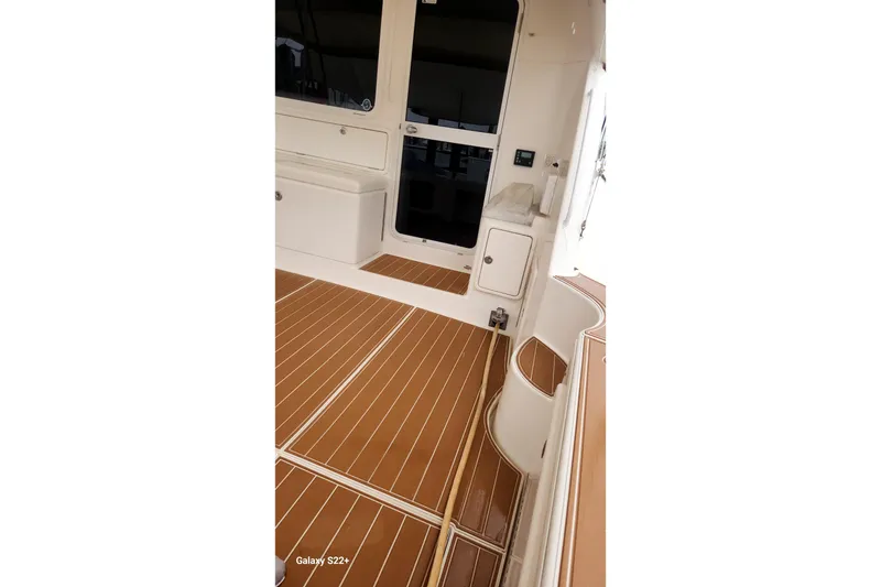 Slide: The Image of 2006 Riviera 47 Open Flybridge Series II, teak deck, white interior, yacht detail. - 32