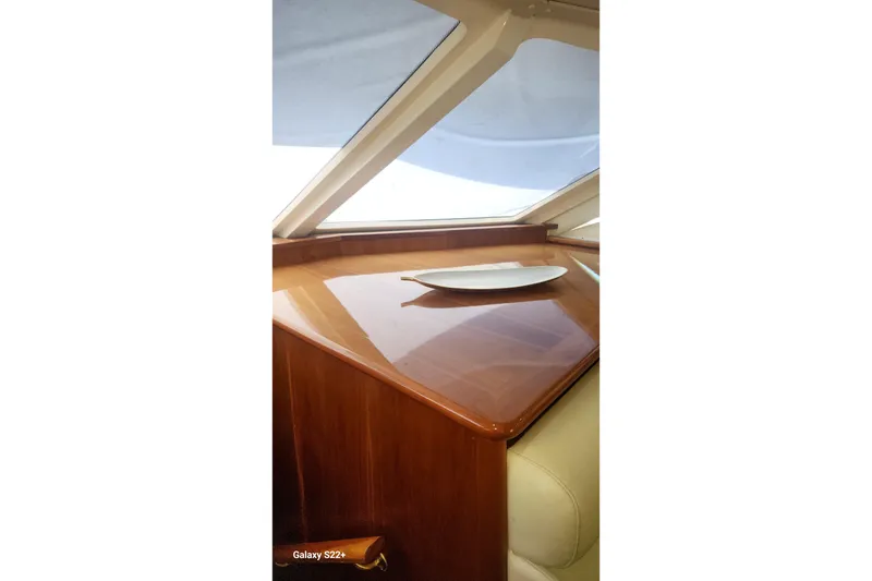 Slide: The Image of Interior of 2006 Riviera 47 Open Flybridge Series II with polished wood finish. - 36