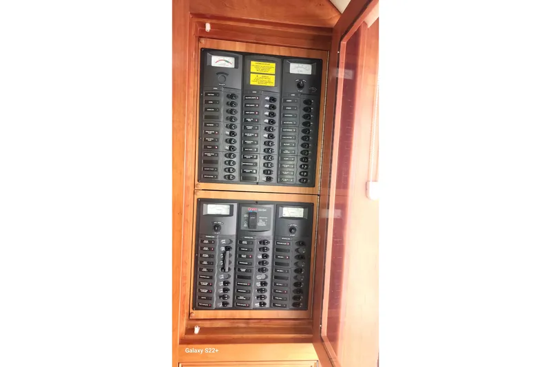 Slide: The Image of Electrical panel on 2006 Riviera 47 Open Flybridge Series II yacht. - 38