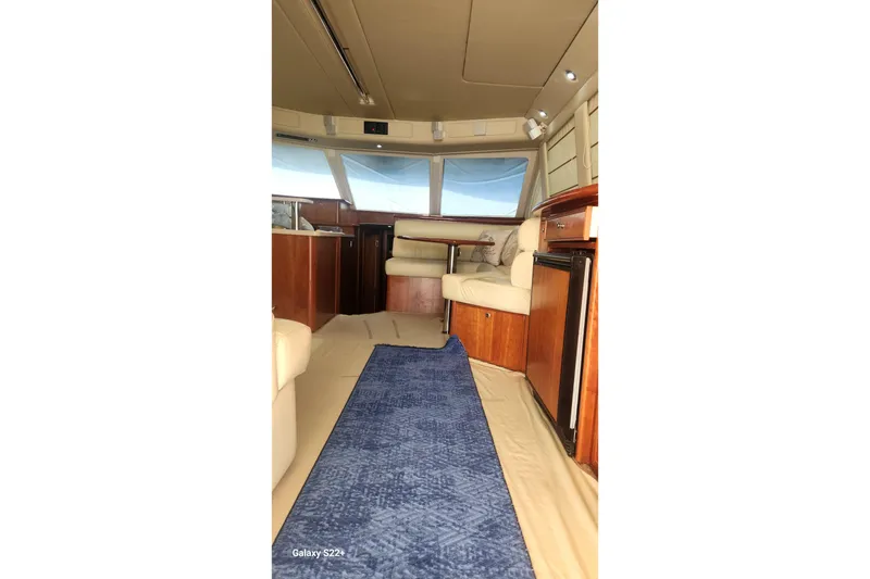 Slide: The Image of Interior of 2006 Riviera 47 Open Flybridge Series II yacht with seating and kitchenette. - 39