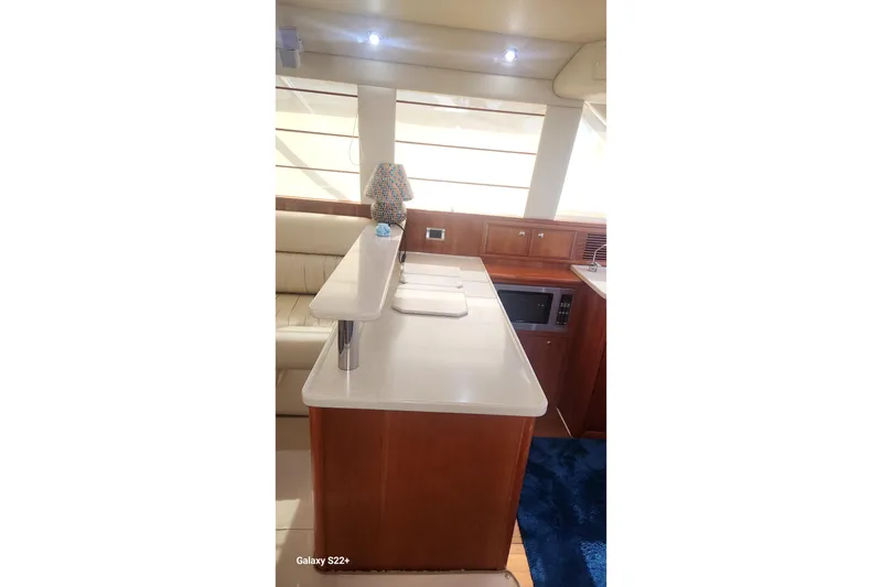 Slide: The Image of Interior of 2006 Riviera 47 Open Flybridge Series II yacht with modern kitchen amenities. - 41