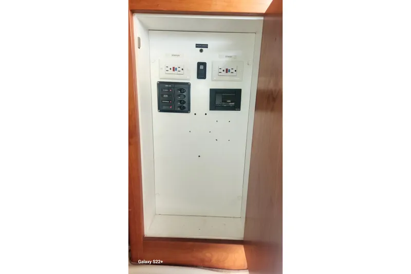 Slide: The Image of Electrical panel on a 2006 Riviera 47 Open Flybridge Series II yacht. - 43