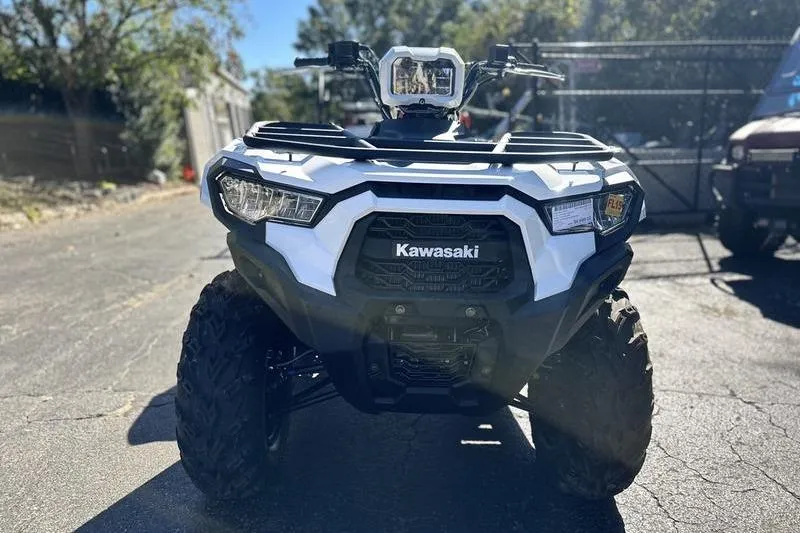 Slide: The Image of 2025 Kawasaki Brute Force 450 ATV, front view, parked outdoors. - 3