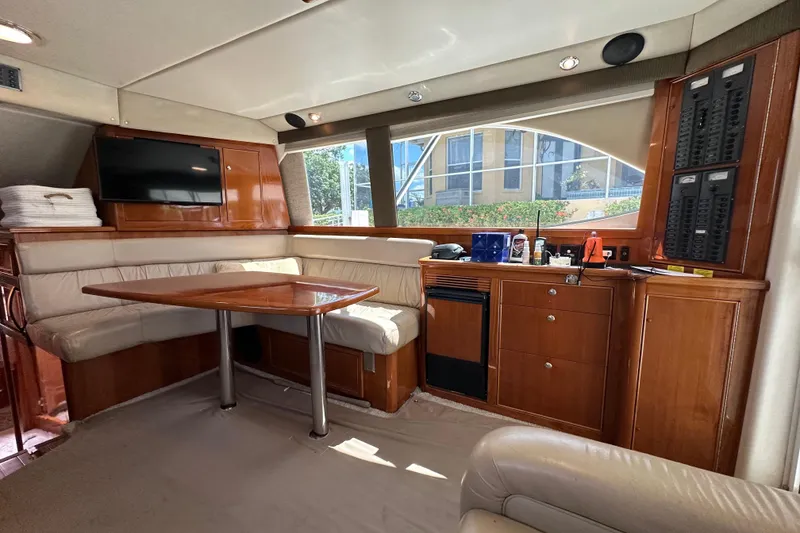 Slide: The Image of Luxurious interior of 2002 Riviera 40 Flybridge yacht with dining area and modern amenities. - 32