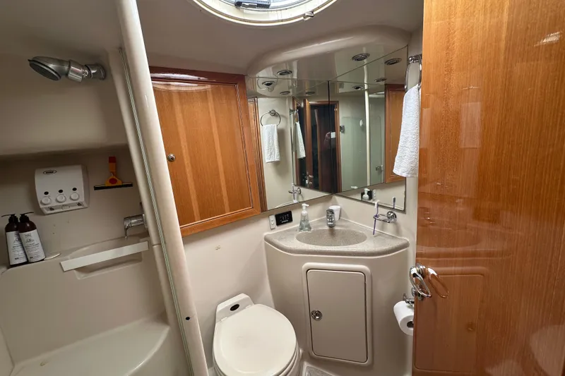 Slide: The Image of Bathroom interior of 2002 Riviera 40 Flybridge yacht, featuring sink, toilet, and shower. - 39