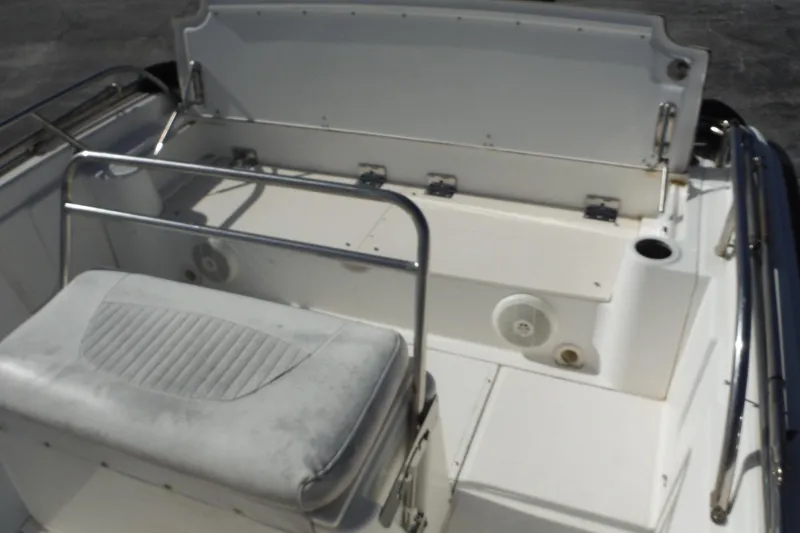 Slide: The Image of 2007 Boston Whaler 180 Dauntless boat interior with seating and storage area. - 14