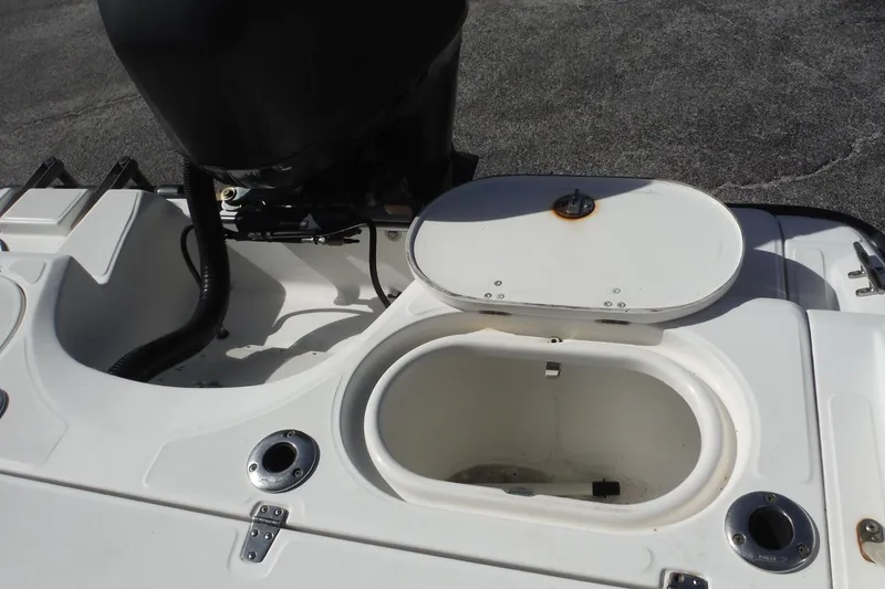 Slide: The Image of 2007 Boston Whaler 180 Dauntless boat interior with open storage compartment. - 19
