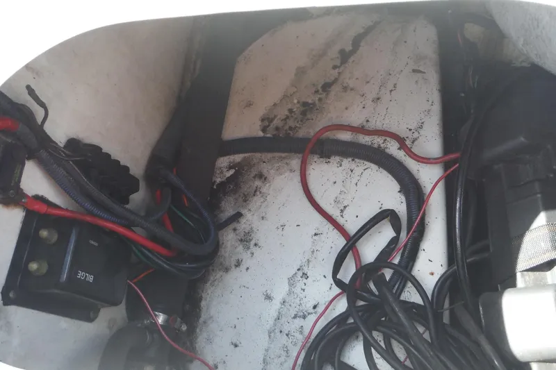 Slide: The Image of 2007 Boston Whaler 180 Dauntless wiring and bilge area with cables and components. - 20