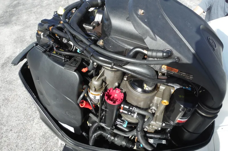 Slide: The Image of 2007 Boston Whaler 180 Dauntless engine, detailed view of components and wiring. - 21