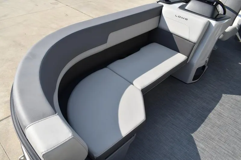 Slide: The Image of 2026 Lowe LS 170 boat interior with sleek gray seating and modern design. - 11