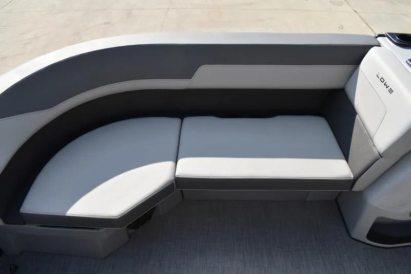 Slide: The Image of Interior storage compartment of 2026 Lowe LS 170 boat with cup holders. - 14