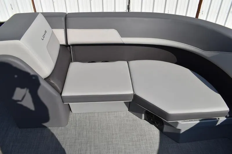 Slide: The Image of 2026 Lowe LS 170 boat interior storage compartment with cushioned seating. - 15
