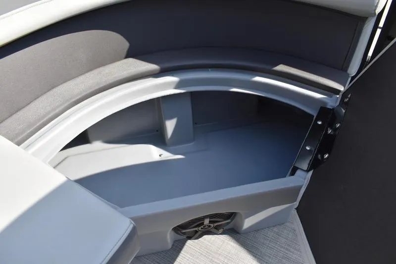 Slide: The Image of Interior view of 2026 Lowe LS 170 boat storage compartment with speaker. - 21