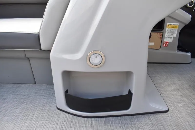 Slide: The Image of 2026 Lowe LS 170 boat interior detail with gray seating and storage compartment. - 24