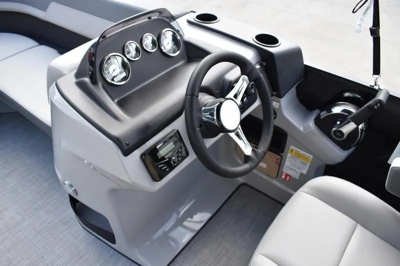 Slide: The Image of 2026 Lowe LS 170 boat dashboard with steering wheel and gauges. - 26